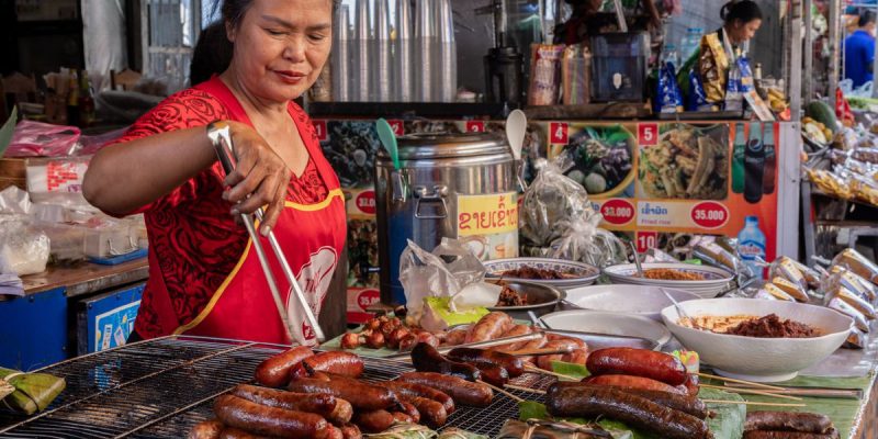 Merchants_grilling_sausages_and_dried_meat.jpg