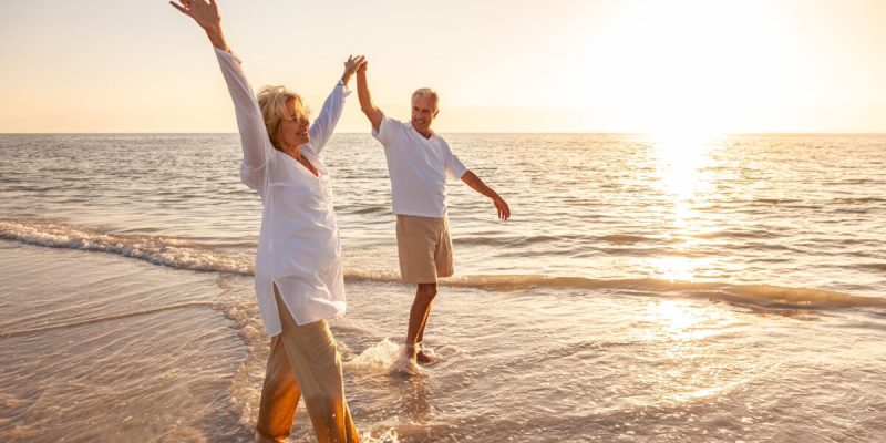 Older-couple-on-beach-scaled.jpg